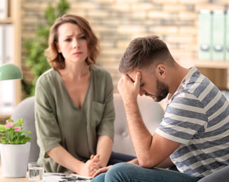 female doctor listening to the sad patient