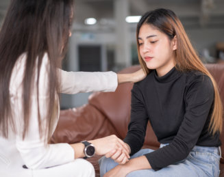 lonely woman sobbing with her doctor