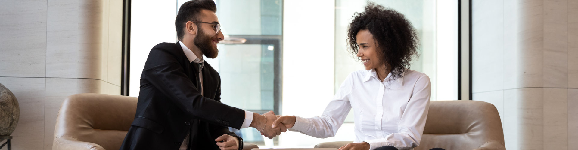 female doctor and patient handshaking